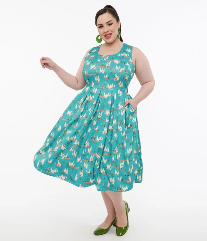 Dolly and Dotty 1950s Turquoise Meerkat Print Amanda Swing Dress Dresses Unique Vintage Pocket Dresses Dolly and Dotty 1950s Turquoise Meerkat Print Amanda Swing Dress Dresses Unique Vintage Pocket Dresses