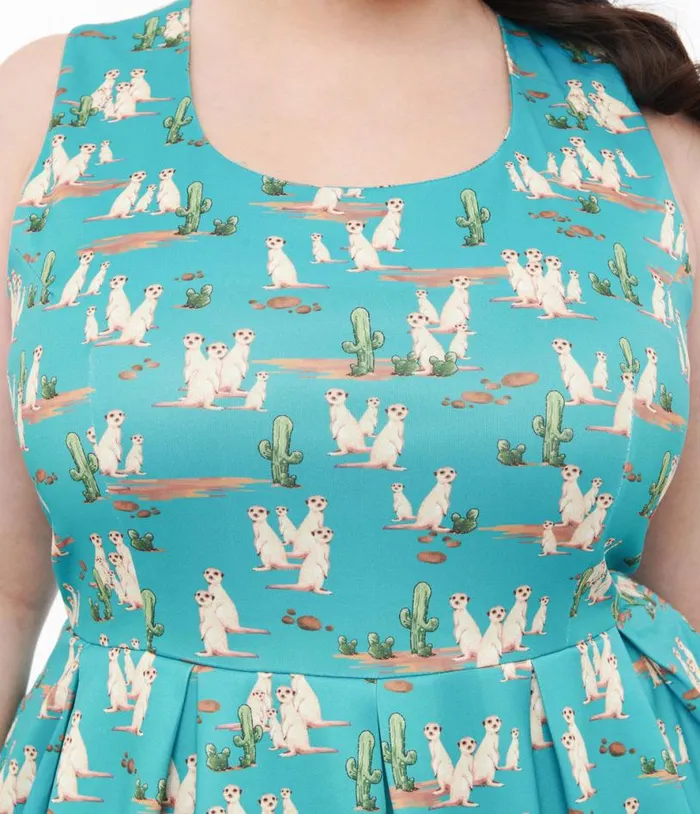 Dolly and Dotty 1950s Turquoise Meerkat Print Amanda Swing Dress Dresses Unique Vintage Pocket Dresses