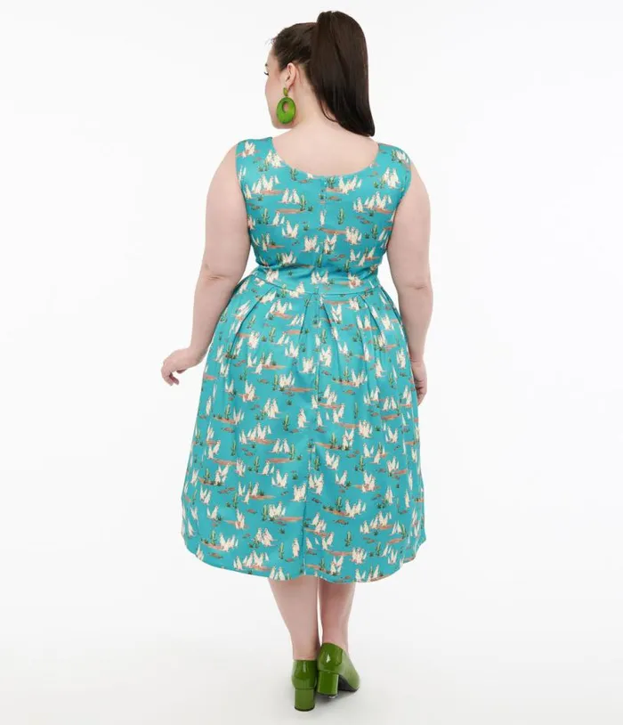 Dolly and Dotty 1950s Turquoise Meerkat Print Amanda Swing Dress Dresses Unique Vintage Pocket Dresses