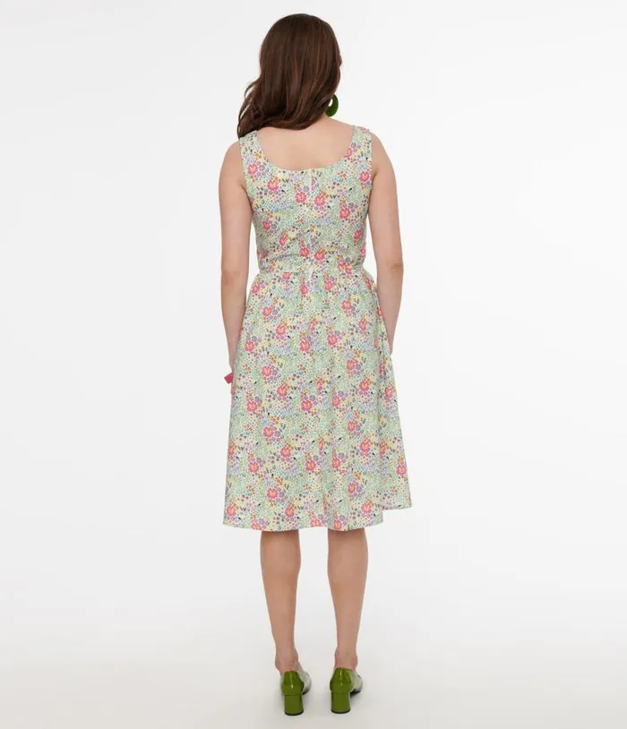 Retrolicious 1950s Green Floral Cat Print Fit and Flare Dress Dresses Unique Vintage Pocket Dresses