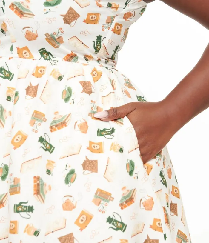 Retrolicious Plus Size 1950s Cream Book and Tea Print Cotton Swing Dress Dresses Unique Vintage Pocket Dresses