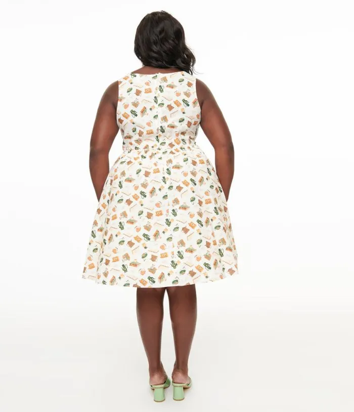 Retrolicious Plus Size 1950s Cream Book and Tea Print Cotton Swing Dress Dresses Unique Vintage Pocket Dresses
